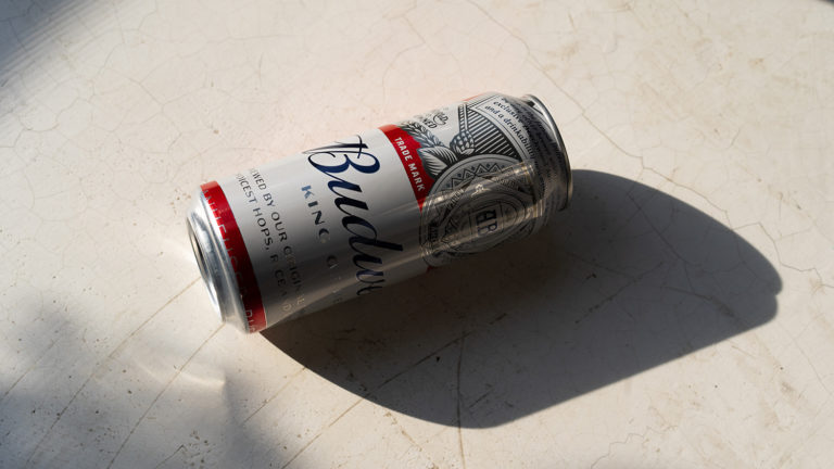 Can of Budweiser beer on ground